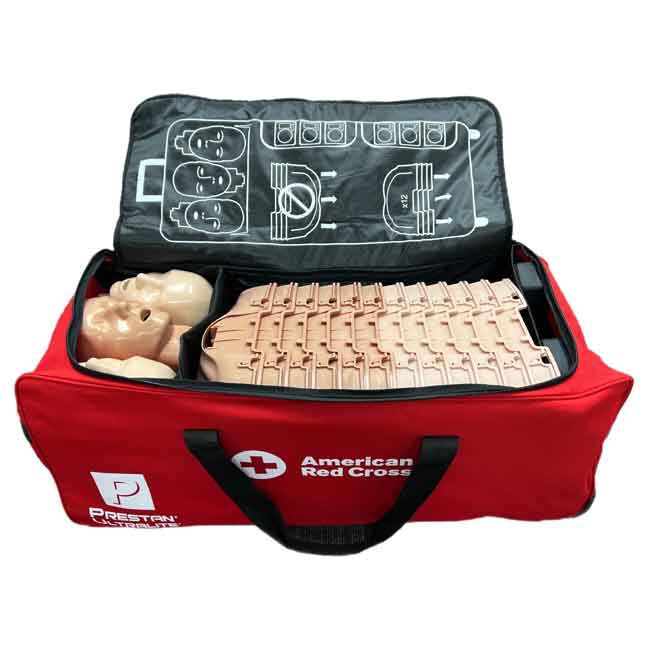 12 Prestan Ultralite Adult CPR Manikins stacked together inside a carrying case with stacking instructions shown on the interior lid flap of the case.