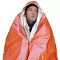 A person wearing the Survive Outdoors Longer (SOL) Emergency Blanket.