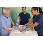 A group of three students using the Ambu SPUR II Infant BVM on an infant CPR manikin.