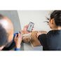 An Instructor Monitoring CPR Compressions on a Little Anne QCPR Enabled Adult CPR Manikin with a Smartphone.
