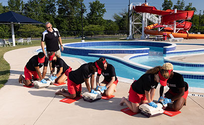 Lifeguarding training by instructor at aquatic facility