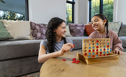 Babysitter playing a game with a child.